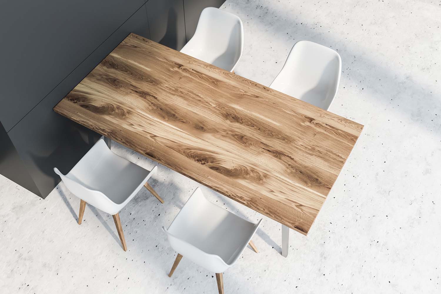 Top view of wooden dining table with four chairs standing in dining room with gray walls and stone floor. 3d rendering